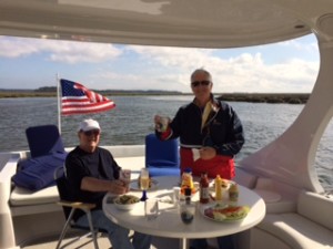 Dinner is served!  Brisk breeze and warm sun were welcome companions for our al fresco dinner along with Roger and Will, of course! 