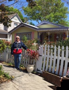 Roger poses in front of a cozy cottage in Fernandina's historic district.  Love the lime green and pink paint!