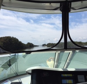 The canal across an island with a bridge in the middle is shown through the windshield to give you an idea of how narrow it is.