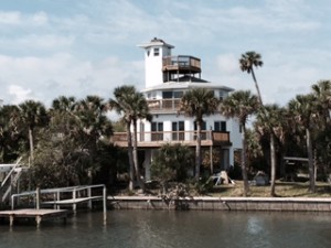 This homeowner has a problem. An osprey has built a nest at the top of the lighthouse pillar.  He or she (the osprey, not the homeowner) was in residence as we passed.