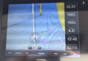 This shot of our electronic chart gives you an idea of just how narrow the ICW channel is.  The white indicates navigable water; the blue means shallow.