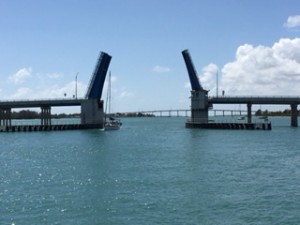 The first "iffy" bridge we came to was opening for a sailboat so we scooted through.  For the remaining low-height bridges, we had to take our chances with the heights.  Bridge tenders insisted we could make it.  They were right.  But the trip through each of them was scary!