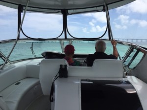 Ann and Cliff at the helm with a view that is very reminiscent of Marathon's Seven Mile Bridge.