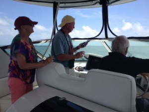 Dot.Calm's navigation team at work.  Cliff at the helm, Jim checking Google Maps and Ann keeping track of day marks and bridge heights.