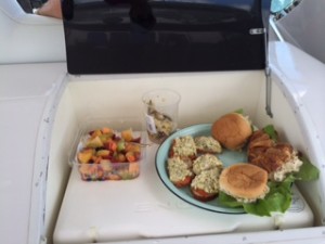 A crew must be nourished.  Here's our lunch buffet -- fruit salad, artichoke salad, egg salad with salmon and chicken salad on croissants.  All of it from "leftovers" on board.