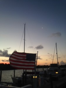 Carolyn captured this early morning shot on day of departure.  Crescent moon (an Ann's moon) for good luck....but the flag shows we will deal with a stiff wind off the dock.  Happily, winds died down considerably before we headed to the fuel dock.