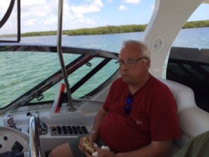 Cliff grabs his lunch at the wheel.  Ann must have not done a very good job :-)